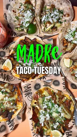 Taco platter with various flavors and margaritas at Madre's Taco Tuesdays in Manchester.