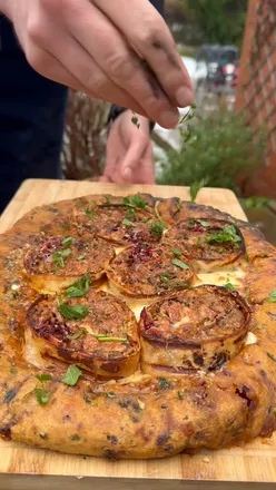 Delicious burrito stuffed with ingredients, showcased alongside a cheesy pizza for a comfort food feast.