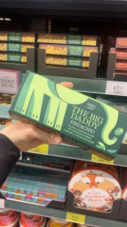 Close-up of a pistachio chocolate bar from Marks & Spencer, highlighting its rich texture and vibrant color.