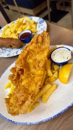 Delicious fish and chips with chippy sauce, deep fried Mars bar, and cocktails at Landy's on Edinburgh's Royal Mile.