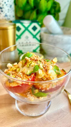 Roasted nectarines with orange, basil, maple mascarpone, and pistachio amaretti crumb, a summer dessert delight.