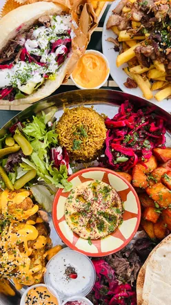 Delicious Palestinian lamb sandweesh and chicken shawarma loaded fries at Baity MCR in Manchester.
