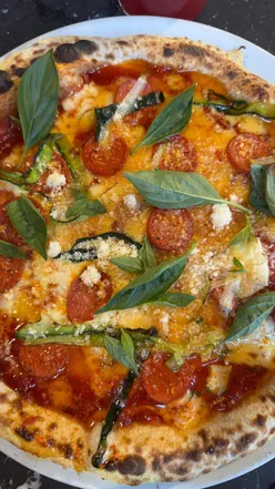 Delicious build-your-own pizza and sweet cocktails at Pizza Punks, perfect for a bottomless brunch in Leeds.