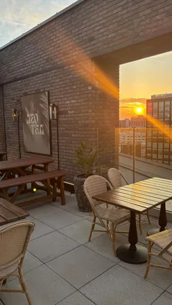 Rooftop terrace at Azotea Leeds with stunning decor, sharing plates, tacos, and cocktails against a city view.
