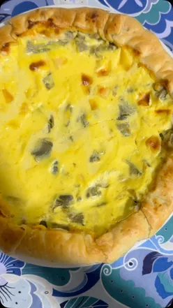 Baked artichoke, eggs, and ricotta cheese dish, perfect for vegetarian dinner recipes in London.