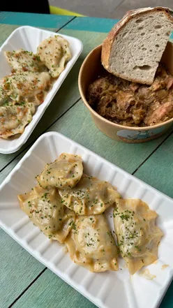 Delicious Polish pierogi with pork filling and crispy lard at Edinburgh Street Food, showcasing authentic cuisine.