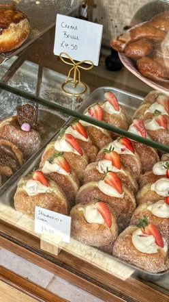 Delicious strawberry foam matcha and pistachio doughnuts at Eve Bakery in Sheffield, perfect for a girly day out.