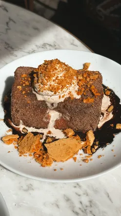Delicious Tiramatoast with brioche French toast, coffee mascarpone, chocolate sauce, and hokey pokey.