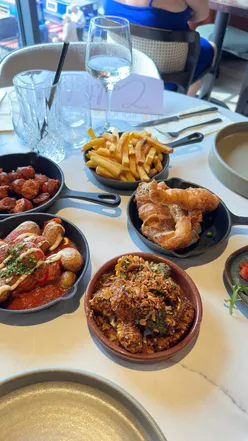 Tapas Roulette featuring chorizo, patatas bravas, bruschetta, and additional seafood dishes at Mercia Marina.