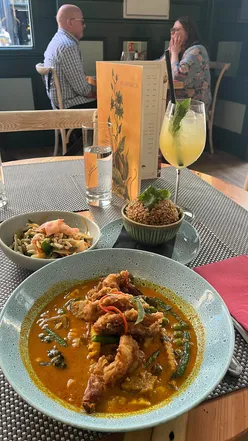 Giggling Squid in Leeds city centre with stunning interiors, chicken satay, salmon one bite, soft shell crab curry, and cocktails.