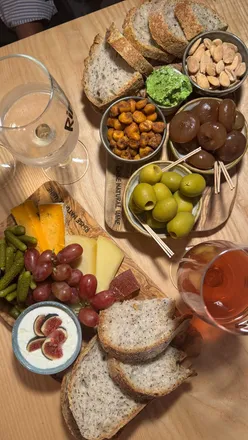 A cozy wine bar in Leeds serving unique wines, whipped goat cheese, truffle honey, and figs for a perfect evening.