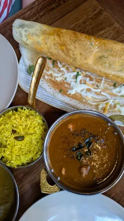 Delicious South Indian dishes at Madurai: cheese dosa, seafood croquettes, and unique curries in Glasgow.