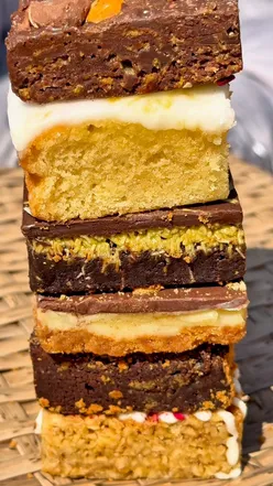 A delicious mixed brownie box featuring pistachio, Biscoff, and lemon cake from Shane's Desserts.
