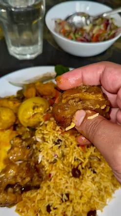 A delicious spread of rice, curry, and fish curry enjoyed during a family lunch in Birmingham.