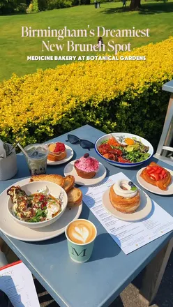 Brunch at Medicine Bakery in Birmingham's Botanical Gardens, featuring baked goods and coffee in a lush setting.