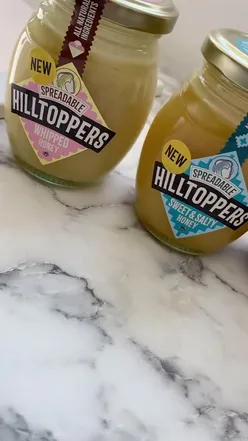 A variety of Hilltop honeys displayed, perfect for baking and cooking, showcasing sweet and salty flavors.