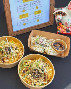 Delicious cold noodles with chicken, cucumber, peanuts, and chili oil at Mama Lala's stall in Cardiff.