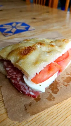 Delicious foccacia sandwich with salami, mozzarella, and fresh tomato at La Fugassa on Chapel Street.