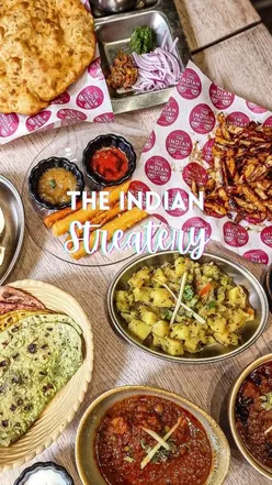 Authentic Indian fusion dishes at The Indian Streatery in Birmingham, featuring Masala fries, Paneer fries, and Mango Lassi.