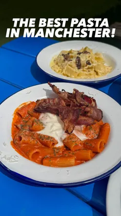 Ornella's Kitchen al fresco dining at Freight Island, Manchester, featuring Rigatoni alla Vodka, Nutella Cheesecake, and Red Pesto Sourdough.