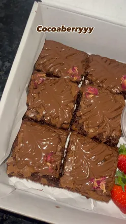 Rich, fudgy brownies with fresh strawberries and chocolate sauce from COCOABERRYYY in Leicester, perfect for breakfast.