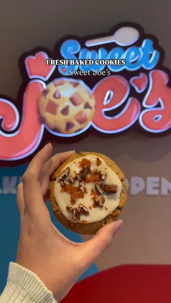 Fresh baked cookies at Sweet Joe's in Grand Central, featuring Carrot Cake Special and Classic Chocolate Chip, Birmingham UK.