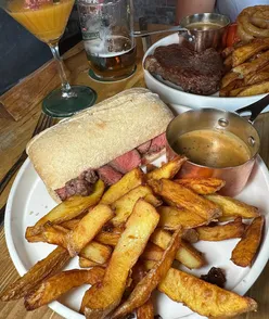 Steak ciabatta with chips, peppercorn sauce, cheeseburger spring rolls, salt and pepper chicken at The New Punch Bowl, Craghead.