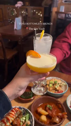 Tapas bottomless brunch at The Gin Vault, Birmingham; enjoy 90 mins of unlimited drinks and 3 tapas dishes in a vibrant canalside setting.