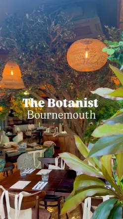 The Botanist Bournemouth opening night with cocktails, hanging kebabs drizzled with sauce, and lush decor with greenery.