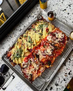 Detroit-style square pizza with Bada Bing and Veg-a-Squarian toppings, cheese pull, hot honey drizzle at Wylam Brewery, Newcastle.