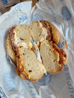Breakfast bagel with bacon, cream cheese, and chili jam at Taylor's Bagels, Keynsham's new store opening.