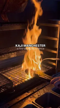 Lobster sushi and signature cheese hotdog at KAJI, Manchester. Japanese milk bread with jalapeño butter, coal-fired grill dining.
