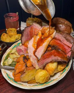 Sunday roast at Blacklock Manchester with beef, pork, lamb, trimmings, unlimited gravy, white chocolate cheesecake, cherry mezcalitas.