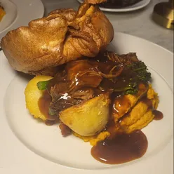 Manchester's Menagerie restaurant Sunday roast with minted lamb, filet mignon, duck croquettes, pork belly, prawn tempura, cookie pie, NYC cheesecake.