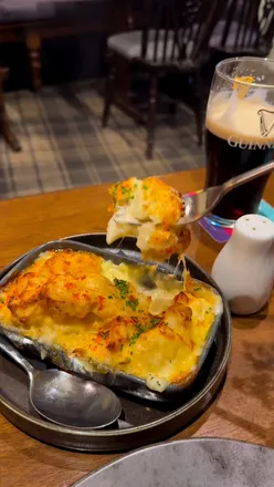 Sunday roast at The Turkey Inn: tender roast beef, towering Yorkshire puddings, creamy cauliflower cheese, and sticky toffee pudding.