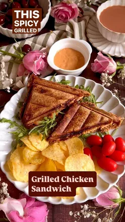Spicy grilled chicken sandwich with onions, tomatoes, chillies, coriander, harissa, and chilli garlic chutney, grilled to crispy perfection.