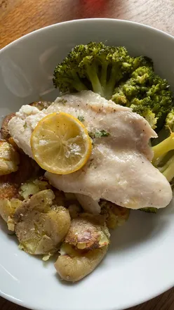 Lemon and parsley Basa fish with broccoli, garlic rosemary crushed baby potatoes; quick, healthy mid-week meal.