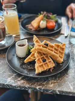 Waffles from Pantry Bruntsfield with Nutella latte, perfect brunch spot with cozy vibe.
