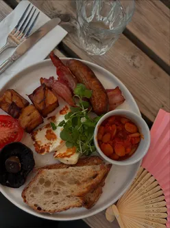 Gorgeous breakfast at The Buttery Belgravia with halloumi, potatoes, Allotment Breakfast, Smashed Avocado, Pancakes, Eggs Benedict, Shakshuka.