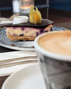 Blueberry and white chocolate cheesecake at Cafe Grande in Edinburgh, perfect for a coffee and cake date.