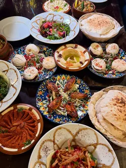 Influencer evening at Babtooma UK in Leeds featuring vibrant summer menu with beetroot salad, creamy hummus, tahini fish, and Dubai Kunafa cup.