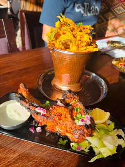 Indian Tiffin Room feast in Liverpool: crispy okra fries, paneer pakoda, lamb chops, sev puri, channa batura, Tanjore chicken, garlic naan, jeera pulav, Aperol Spritz, Cobra beer.