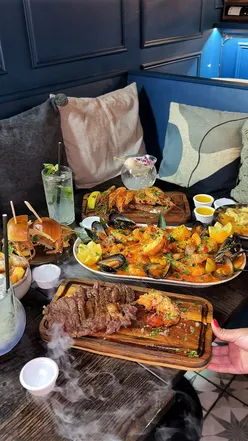 £45 seafood boil platter with lobster at The Sea Garden UK, Norbury, London; includes juicy steak, grape fishbowl cocktail.
