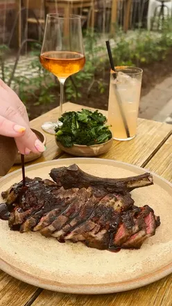 Farm-to-table meal at Kynd Hampton Manor with scallops, cote du boeuf, potato fondant, woodfired carrots, and organic BBQ greens.