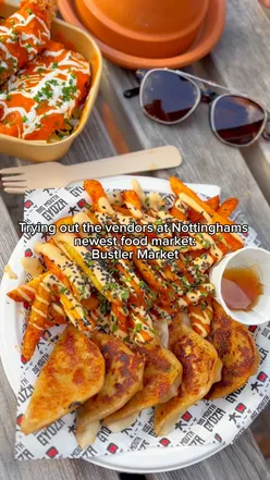 Bustler Nottingham food market with smoky Argentinian beef, juicy smash burger, pork belly gyoza fries, and buffalo chicken tenders.