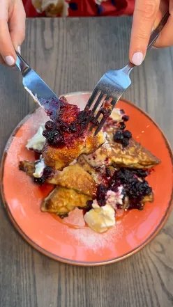Mango margarita, mimosa, full English breakfast, and brioche French toast at Exhibit Balham, a lively brunch spot in London.