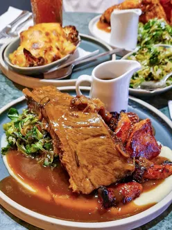 Tender overnight beef short rib roast with red wine, rosemary, and gluten-free cauliflower cheese at Hort's Townhouse, Bristol. Enjoyed with a Margarita spritz from the summer drinks menu and a gluten-free lemon posset dessert.
