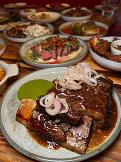 Tapas at Campo Blanco: crispy patatas bravas, jamón croquetas, tenderstem broccoli, crispy chicken, beef short rib, flat iron steak, pork chop, fried aubergine, whipped burrata with charred bread.