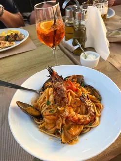 Zakynthos holiday with seafood linguine at Target Taverna, gyros platter at Skyfall Pool Bar, and halloumi skewer at The Garden.