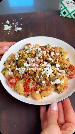 Spicy feta butterbean chicken salad with roasted red pepper, cherry tomatoes, olives, and creamy Greek yogurt dressing.